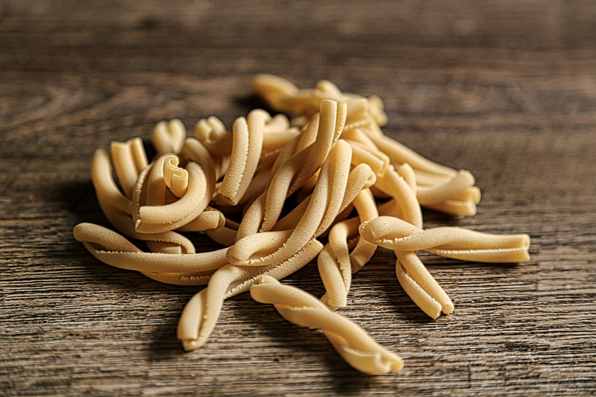 In Italian, the word casereccio means homemade. Casarecce is traditionally made by wrapping the pasta around a thin rod known as a 